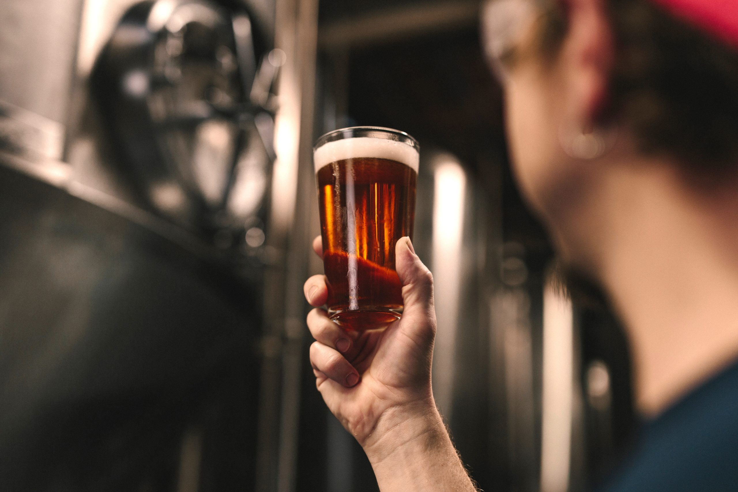 Man holding beer glass
