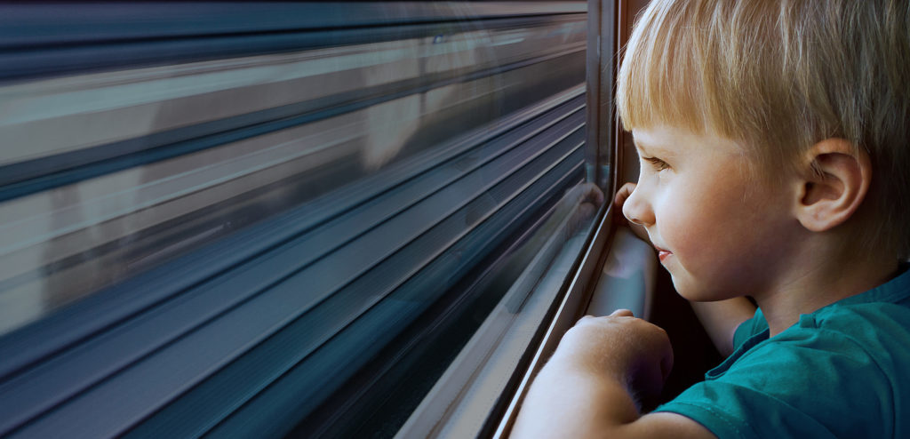 Child Boy in the Train by the Window